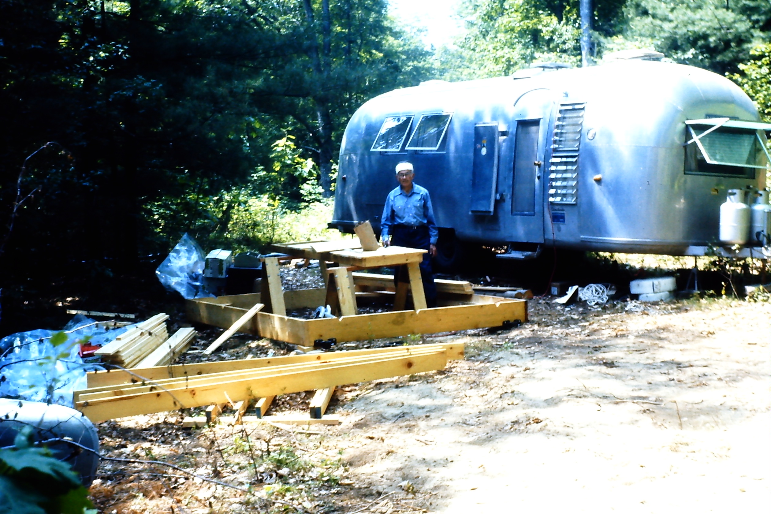 Grandpa in front of the airstream, building the dock