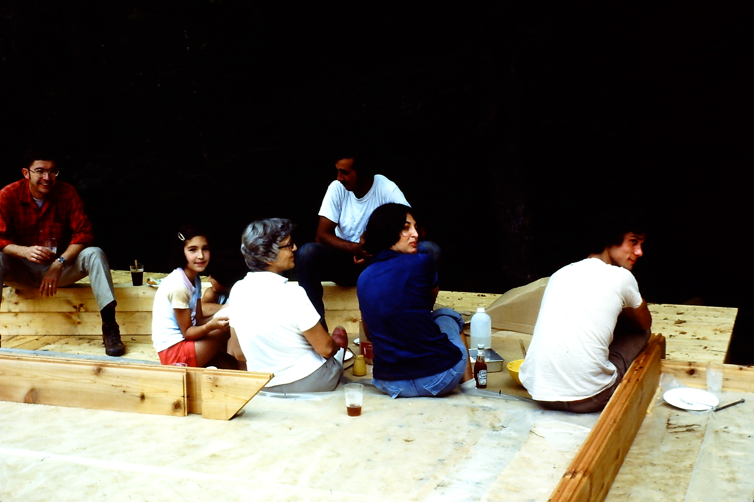 Lunch break on the deck! Bob, Sarah, Grandma R, Mustard, Cynthia, Catsup, Wayne (? one of the Olivieri sons who helped build the cabin).  Can't identify the person sitting across from the rest of us!